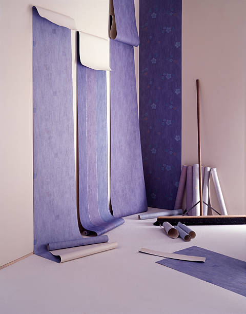 Installation of blue color wallpaper in a new apartment